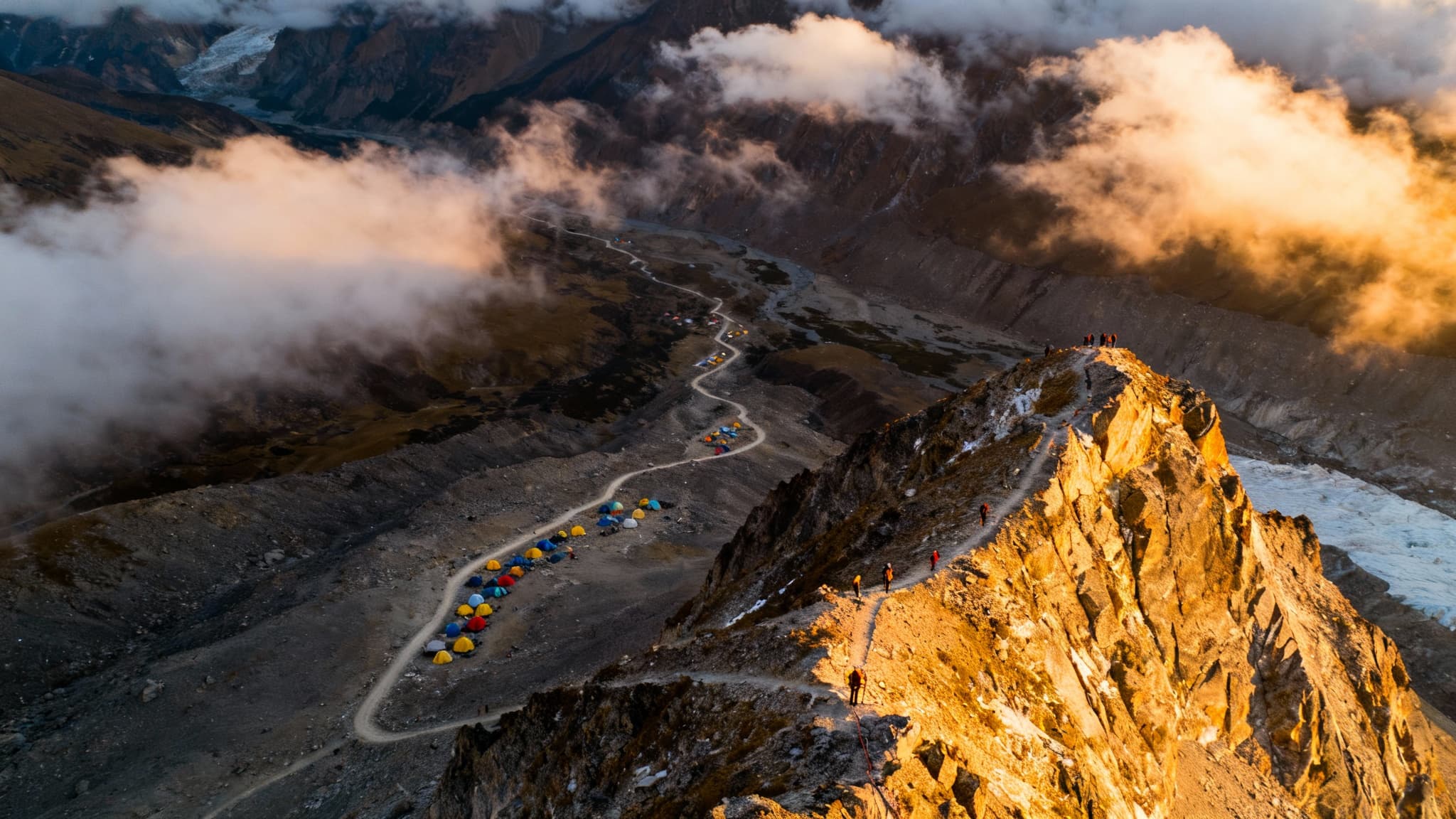 Summit perspective view looking down at expedition route and camps below